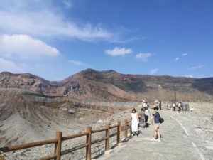aso volcano standing on the crater edge, kumamoto sightseeing