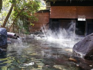 outdoor hotspring, steam rising from water Kurokawa Onsen Kumamoto sightseeing spot
