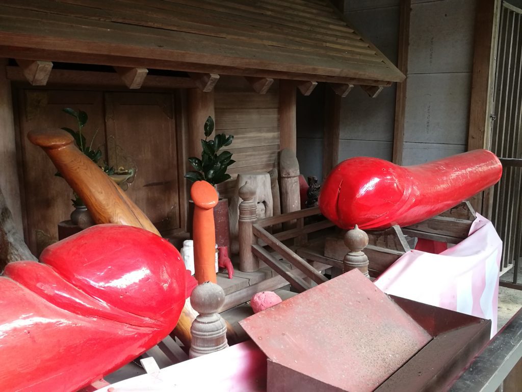 Red wooden Penis offering shinto shrine fertility worship japan