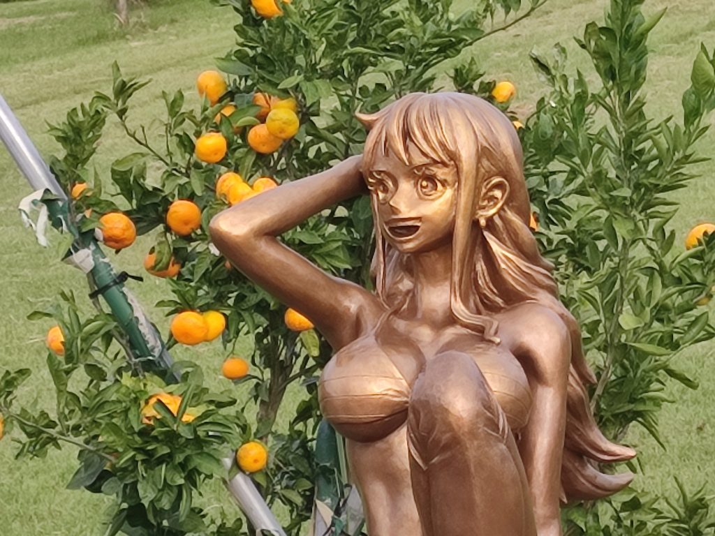 Nami One piece statue with oranges